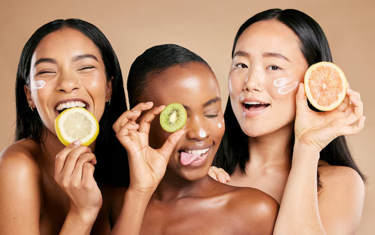 women holding vitamin c fruits